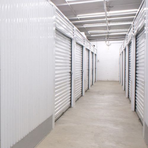 The image shows self storage units hallway